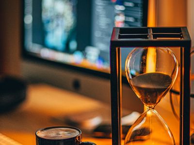 Close up of a wooden hourglass on a desk